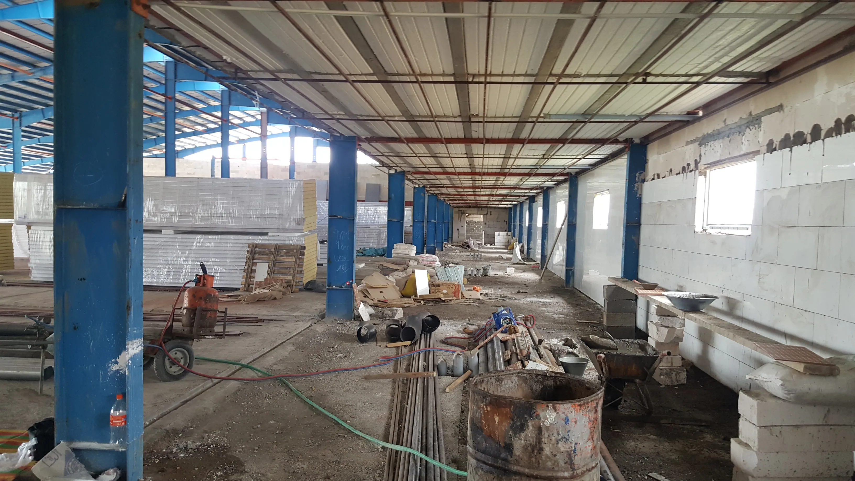 Enari growing racks — wide view across the hall